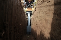 Chain trencher in action
