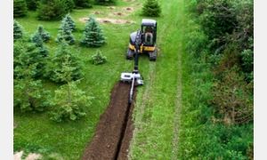 TN548 Chain Trencher digging a trench.